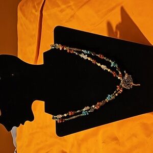 Stone and bead necklace with tree and bird